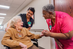 Woman in wheelchair happy to see friend
